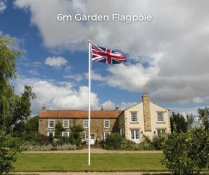 Garden flagpole flying union in front of house
