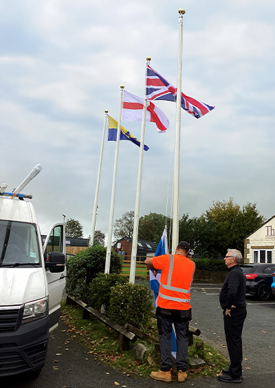 Flagpole servicing being undertaken