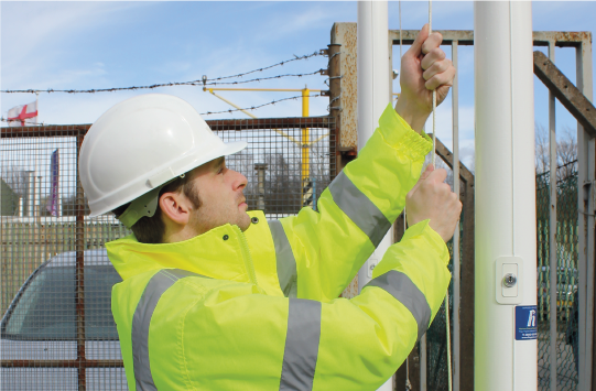 Team member servicing a flagpoles