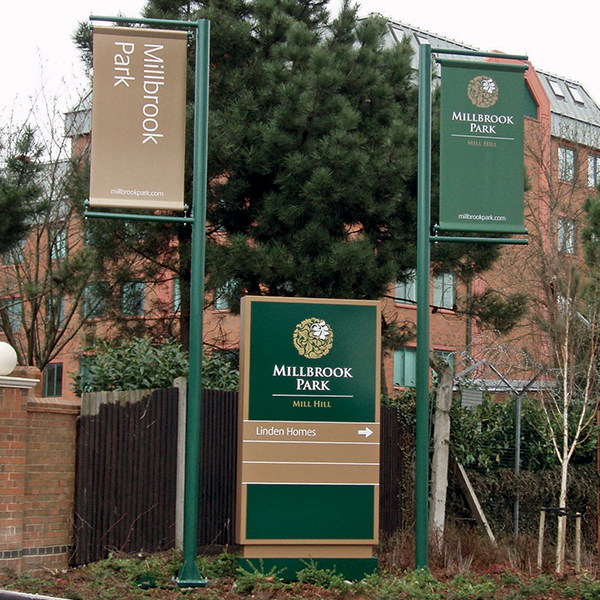 Ground mounted banner pole at housing development